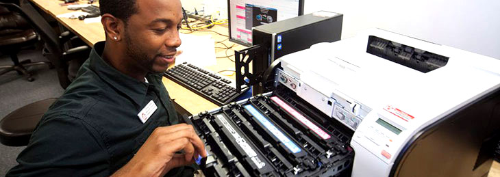 Technician Repairing Printer